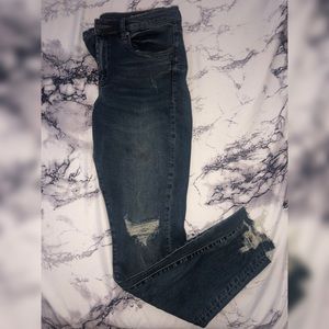 Distressed mid rise skinny jeans